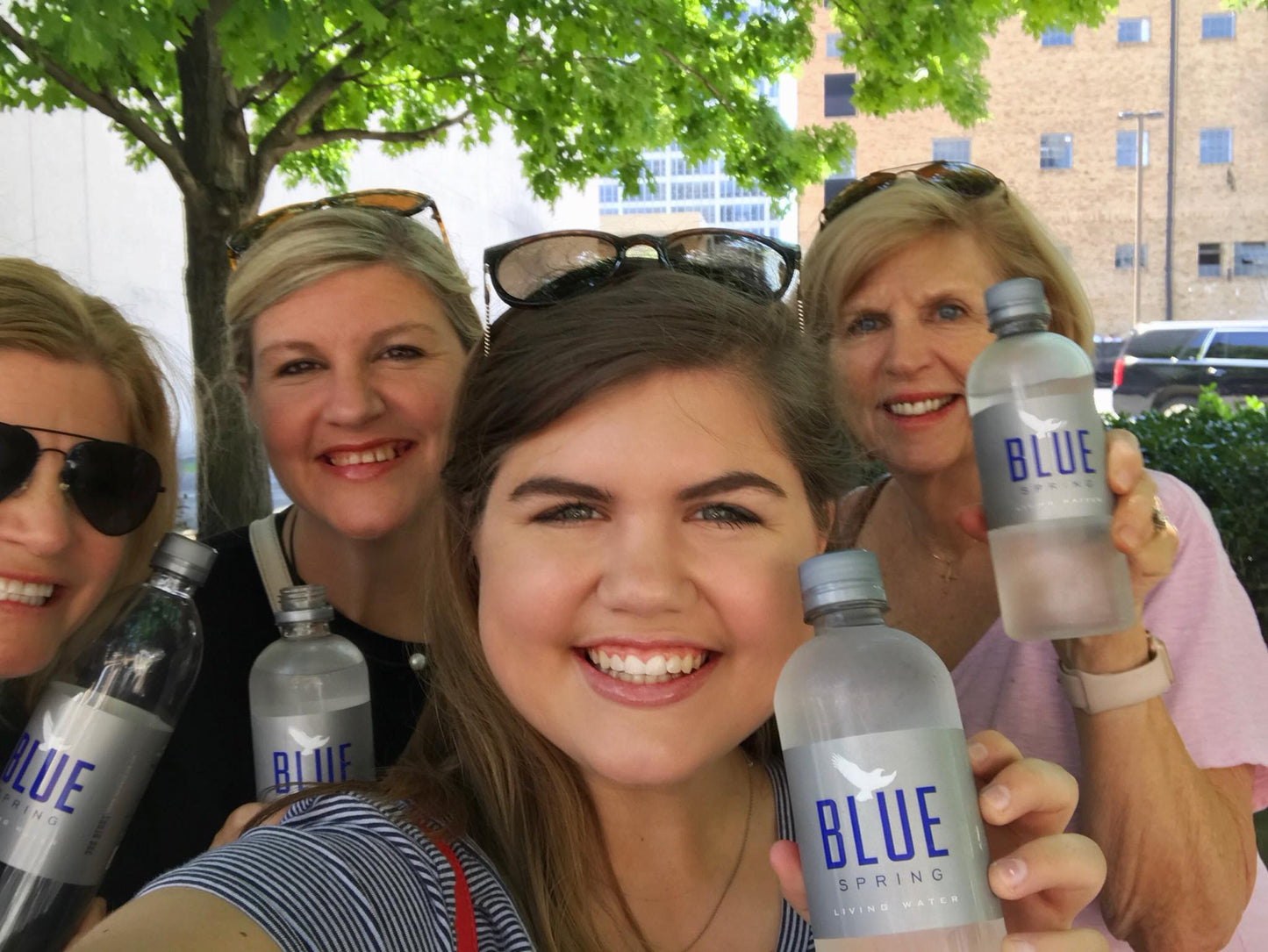 Fans drinking Blue Spring Living Water outdoors