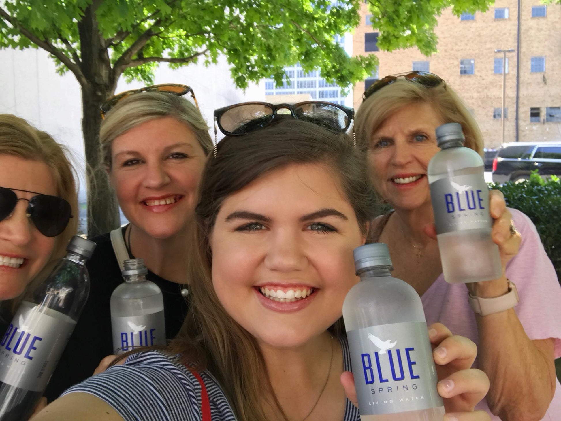 Happy customers enjoying Blue Spring Living Water
